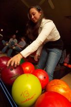 Allison Lear reaching for a bowling ball.  Alpha Xi Delta held a sock hop themed date night at the Austin 300 bowling alley, Thursday night, March 29, 2007.

Filename: SRM_20070329_2050141.jpg
Aperture: f/8.0
Shutter Speed: 1/200
Body: Canon EOS-1D Mark II
Lens: Sigma 15-30mm f/3.5-4.5 EX Aspherical DG DF