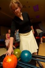 Heidi Frank reaching for a bowling ball.  Alpha Xi Delta held a sock hop themed date night at the Austin 300 bowling alley, Thursday night, March 29, 2007.

Filename: SRM_20070329_2100480.jpg
Aperture: f/8.0
Shutter Speed: 1/200
Body: Canon EOS-1D Mark II
Lens: Sigma 15-30mm f/3.5-4.5 EX Aspherical DG DF