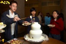 Angela Fung and Arlena Yu.  The Asian Business Students Association (ABSA) hosted a chocolate fondue Friday, January 26, 2007 before heading off to a movie premier.

Filename: SRM_20070126_1617441.jpg
Aperture: f/4.5
Shutter Speed: 1/160
Body: Canon EOS 20D
Lens: Canon EF-S 18-55mm f/3.5-5.6