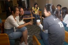 Thu Mai, Thu Vo, and Julia Kuo talking.  The Asian Business Students Association (ABSA) hosted a chocolate fondue Friday, January 26, 2007 before heading off to a movie premier.

Filename: SRM_20070126_1621105.jpg
Aperture: f/5.6
Shutter Speed: 1/125
Body: Canon EOS 20D
Lens: Canon EF-S 18-55mm f/3.5-5.6