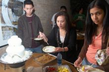 Lance Shyr, left, and Michelle Hoang enjoying the white chocolate.  The Asian Business Students Association (ABSA) hosted a chocolate fondue Friday, January 26, 2007 before heading off to a movie premier.

Filename: SRM_20070126_1624509.jpg
Aperture: f/5.0
Shutter Speed: 1/125
Body: Canon EOS 20D
Lens: Canon EF-S 18-55mm f/3.5-5.6