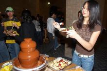 Deby Thomas, left, and Linda Dao enjoying the chocolate fondue.  The Asian Business Students Association (ABSA) hosted a chocolate fondue Friday, January 26, 2007 before heading off to a movie premier.

Filename: SRM_20070126_1626403.jpg
Aperture: f/5.0
Shutter Speed: 1/125
Body: Canon EOS 20D
Lens: Canon EF-S 18-55mm f/3.5-5.6