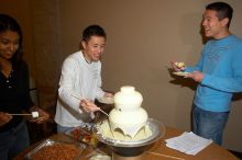 Khang Huynh and Samuel Liu.  The Asian Business Students Association (ABSA) hosted a chocolate fondue Friday, January 26, 2007 before heading off to a movie premier.

Filename: SRM_20070126_1628567.jpg
Aperture: f/5.0
Shutter Speed: 1/125
Body: Canon EOS 20D
Lens: Canon EF-S 18-55mm f/3.5-5.6