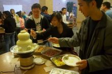 Andrew Wu, Mimi Nguyen, and Quan Ma.  The Asian Business Students Association (ABSA) hosted a chocolate fondue Friday, January 26, 2007 before heading off to a movie premier.

Filename: SRM_20070126_1632240.jpg
Aperture: f/4.5
Shutter Speed: 1/40
Body: Canon EOS 20D
Lens: Canon EF-S 18-55mm f/3.5-5.6