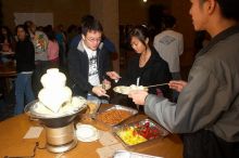 Andrew Wu, Mimi Nguyen, and Quan Ma.  The Asian Business Students Association (ABSA) hosted a chocolate fondue Friday, January 26, 2007 before heading off to a movie premier.

Filename: SRM_20070126_1632321.jpg
Aperture: f/5.6
Shutter Speed: 1/160
Body: Canon EOS 20D
Lens: Canon EF-S 18-55mm f/3.5-5.6