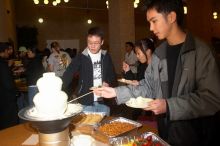 Andrew Wu, Mimi Nguyen, and Quan Ma.  The Asian Business Students Association (ABSA) hosted a chocolate fondue Friday, January 26, 2007 before heading off to a movie premier.

Filename: SRM_20070126_1632442.jpg
Aperture: f/5.6
Shutter Speed: 1/160
Body: Canon EOS 20D
Lens: Canon EF-S 18-55mm f/3.5-5.6