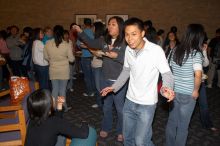 Eddy Fong dancing.  The Asian Business Students Association (ABSA) hosted a chocolate fondue Friday, January 26, 2007 before heading off to a movie premier.

Filename: SRM_20070126_1639344.jpg
Aperture: f/5.6
Shutter Speed: 1/160
Body: Canon EOS 20D
Lens: Canon EF-S 18-55mm f/3.5-5.6