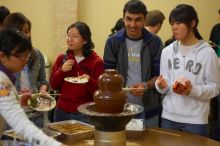 Nalin Verma and Taeyoung Kim.  The Asian Business Students Association (ABSA) hosted a chocolate fondue Friday, January 26, 2007 before heading off to a movie premier.

Filename: SRM_20070126_1651545.jpg
Aperture: f/2.0
Shutter Speed: 1/50
Body: Canon EOS-1D Mark II
Lens: Canon EF 50mm f/1.8 II