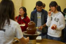 Nalin Verma and Taeyoung Kim.  The Asian Business Students Association (ABSA) hosted a chocolate fondue Friday, January 26, 2007 before heading off to a movie premier.

Filename: SRM_20070126_1652006.jpg
Aperture: f/2.0
Shutter Speed: 1/50
Body: Canon EOS-1D Mark II
Lens: Canon EF 50mm f/1.8 II