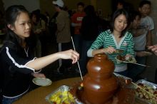 Monica Nguyen and Jacqueline So.  The Asian Business Students Association (ABSA) hosted a chocolate fondue Friday, January 26, 2007 before heading off to a movie premier.

Filename: SRM_20070126_1659444.jpg
Aperture: f/5.6
Shutter Speed: 1/160
Body: Canon EOS 20D
Lens: Canon EF-S 18-55mm f/3.5-5.6