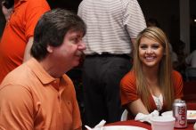 Tahnae Tarkenton eats lunch with her parents.  Kappa Kappa Gamma (KKG) hosted a parents' weekend barbecue before the UT vs Nebraska football game on Saturday, October 27, 2007 at their sorority house.

Filename: SRM_20071027_1131506.jpg
Aperture: f/8.0
Shutter Speed: 1/125
Body: Canon EOS-1D Mark II
Lens: Canon EF 50mm f/1.8 II