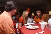 Tahnae Tarkenton eats lunch with her parents.  Kappa Kappa Gamma (KKG) hosted a parents' weekend barbecue before the UT vs Nebraska football game on Saturday, October 27, 2007 at their sorority house.

Filename: SRM_20071027_1137007.jpg
Aperture: f/8.0
Shutter Speed: 1/100
Body: Canon EOS 20D
Lens: Canon EF-S 18-55mm f/3.5-5.6