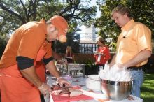 Joyce Pickens and her parents grab some brisket at the KKG BBQ.  Kappa Kappa Gamma hosted a parents' weekend barbecue before the UT vs Nebraska football game on Saturday, October 27, 2007 at their sorority house.

Filename: SRM_20071027_1138220.jpg
Aperture: f/8.0
Shutter Speed: 1/250
Body: Canon EOS 20D
Lens: Canon EF-S 18-55mm f/3.5-5.6