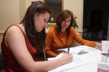 Taylor Kingshill signs the sorority house leasing contract as her mother looks on.  Kappa Kappa Gamma (KKG) hosted a parents' weekend barbecue before the UT vs Nebraska football game on Saturday, October 27, 2007 at their sorority house.

Filename: SRM_20071027_1146500.jpg
Aperture: f/8.0
Shutter Speed: 1/250
Body: Canon EOS 20D
Lens: Canon EF-S 18-55mm f/3.5-5.6