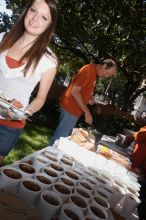 Jill Swanson and her dad grab some barbecue.  Kappa Kappa Gamma (KKG) hosted a parents' weekend barbecue before the UT vs Nebraska football game on Saturday, October 27, 2007 at their sorority house.

Filename: SRM_20071027_1202027.jpg
Aperture: f/8.0
Shutter Speed: 1/250
Body: Canon EOS 20D
Lens: Canon EF-S 18-55mm f/3.5-5.6