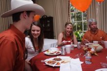 Jill Swanson and her brother, left, with Elizabeth Clinch, right.  Kappa Kappa Gamma (KKG) hosted a parents' weekend barbecue before the UT vs Nebraska football game on Saturday, October 27, 2007 at their sorority house.

Filename: SRM_20071027_1210163.jpg
Aperture: f/8.0
Shutter Speed: 1/250
Body: Canon EOS 20D
Lens: Canon EF-S 18-55mm f/3.5-5.6