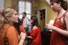 Sisters Allison and Mary Stewart Anderson, both Kappas, with their father.  Kappa Kappa Gamma (KKG) hosted a parents' weekend barbecue before the UT vs Nebraska football game on Saturday, October 27, 2007 at their sorority house.

Filename: SRM_20071027_1238481.jpg
Aperture: f/8.0
Shutter Speed: 1/30
Body: Canon EOS 20D
Lens: Canon EF-S 18-55mm f/3.5-5.6