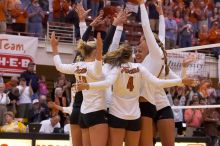UT sophomore Heather Kisner (#19, DS), UT senior Michelle Moriarty (#4, S), and UT sophomore Ashley Engle (#10, S/RS) celebrate a point with their teammates.  The Longhorns defeated the Huskers 3-0 on Wednesday night, October 24, 2007 at Gregory Gym.

Filename: SRM_20071024_1837480.jpg
Aperture: f/4.5
Shutter Speed: 1/400
Body: Canon EOS-1D Mark II
Lens: Canon EF 80-200mm f/2.8 L