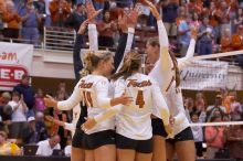UT sophomore Heather Kisner (#19, DS), UT senior Michelle Moriarty (#4, S), and UT sophomore Ashley Engle (#10, S/RS) celebrate a point with their teammates.  The Longhorns defeated the Huskers 3-0 on Wednesday night, October 24, 2007 at Gregory Gym.

Filename: SRM_20071024_1837501.jpg
Aperture: f/4.5
Shutter Speed: 1/400
Body: Canon EOS-1D Mark II
Lens: Canon EF 80-200mm f/2.8 L