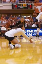 UT freshman Juliann Faucette (#1, OH) stretches out for the dig as UT senior Alyson Jennings (#16, L) watches.  The Longhorns defeated the Huskers 3-0 on Wednesday night, October 24, 2007 at Gregory Gym.

Filename: SRM_20071024_1839141.jpg
Aperture: f/4.0
Shutter Speed: 1/400
Body: Canon EOS-1D Mark II
Lens: Canon EF 80-200mm f/2.8 L