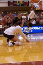 UT freshman Juliann Faucette (#1, OH) stretches out for the dig as UT senior Alyson Jennings (#16, L) watches.  The Longhorns defeated the Huskers 3-0 on Wednesday night, October 24, 2007 at Gregory Gym.

Filename: SRM_20071024_1839162.jpg
Aperture: f/4.5
Shutter Speed: 1/400
Body: Canon EOS-1D Mark II
Lens: Canon EF 80-200mm f/2.8 L