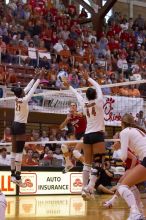 UT sophomore Destinee Hooker (#21, OH) and UT senior Brandy Magee (#44, MB) block a hit from Nebraska senior Sarah Pavan (#9, RS).  The Longhorns defeated the Huskers 3-0 on Wednesday night, October 24, 2007 at Gregory Gym.

Filename: SRM_20071024_1839388.jpg
Aperture: f/4.5
Shutter Speed: 1/400
Body: Canon EOS-1D Mark II
Lens: Canon EF 80-200mm f/2.8 L