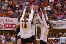 UT sophomore Ashley Engle (#10, S/RS), UT sophomore Destinee Hooker (#21, OH), UT senior Michelle Moriarty (#4, S), UT junior Lauren Paolini (#3, UTIL), and UT senior Alyson Jennings (#16, L) celebrate after a point.  The Longhorns defeated the Huskers 3-0

Filename: SRM_20071024_1840501.jpg
Aperture: f/4.0
Shutter Speed: 1/400
Body: Canon EOS-1D Mark II
Lens: Canon EF 80-200mm f/2.8 L