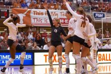 UT sophomore Ashley Engle (#10, S/RS), UT sophomore Destinee Hooker (#21, OH), UT senior Michelle Moriarty (#4, S), UT junior Lauren Paolini (#3, UTIL), and UT senior Alyson Jennings (#16, L) celebrate after a point.  The Longhorns defeated the Huskers 3-0

Filename: SRM_20071024_1842164.jpg
Aperture: f/4.0
Shutter Speed: 1/400
Body: Canon EOS-1D Mark II
Lens: Canon EF 80-200mm f/2.8 L