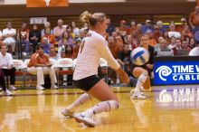 UT sophomore Heather Kisner (#19, DS) hits the ball as UT senior Alyson Jennings (#16, L) watches.  The Longhorns defeated the Huskers 3-0 on Wednesday night, October 24, 2007 at Gregory Gym.

Filename: SRM_20071024_1844166.jpg
Aperture: f/4.0
Shutter Speed: 1/400
Body: Canon EOS-1D Mark II
Lens: Canon EF 80-200mm f/2.8 L