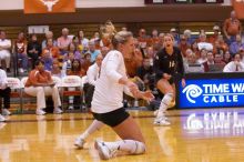 UT sophomore Heather Kisner (#19, DS) hits the ball as UT senior Alyson Jennings (#16, L) watches.  The Longhorns defeated the Huskers 3-0 on Wednesday night, October 24, 2007 at Gregory Gym.

Filename: SRM_20071024_1844187.jpg
Aperture: f/4.0
Shutter Speed: 1/400
Body: Canon EOS-1D Mark II
Lens: Canon EF 80-200mm f/2.8 L