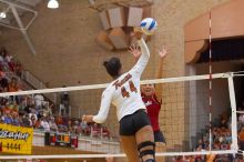 UT senior Brandy Magee (#44, MB) spikes the ball as a Nebraska player attempts to block it.  The Longhorns defeated the Huskers 3-0 on Wednesday night, October 24, 2007 at Gregory Gym.

Filename: SRM_20071024_1844382.jpg
Aperture: f/4.0
Shutter Speed: 1/400
Body: Canon EOS-1D Mark II
Lens: Canon EF 80-200mm f/2.8 L