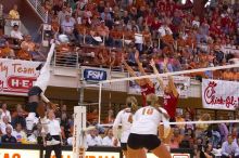 UT senior Brandy Magee (#44, MB) hits the ball towards blockers Nebraska sophomore Kori Cooper (#15, MB) and Nebraska senior Sarah Pavan (#9, RS) as UT senior Michelle Moriarty (#4, S) and UT sophomore Ashley Engle (#10, S/RS) watch.  The Longhorns defeate

Filename: SRM_20071024_1845281.jpg
Aperture: f/4.0
Shutter Speed: 1/400
Body: Canon EOS-1D Mark II
Lens: Canon EF 80-200mm f/2.8 L