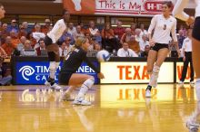 UT senior Alyson Jennings (#16, L) hits the ball as UT sophomore Destinee Hooker (#21, OH) and UT junior Lauren Paolini (#3, UTIL) watch.  The Longhorns defeated the Huskers 3-0 on Wednesday night, October 24, 2007 at Gregory Gym.

Filename: SRM_20071024_1846329.jpg
Aperture: f/4.0
Shutter Speed: 1/400
Body: Canon EOS-1D Mark II
Lens: Canon EF 80-200mm f/2.8 L