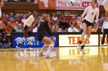 UT senior Alyson Jennings (#16, L) hits the ball as UT sophomore Destinee Hooker (#21, OH) and UT junior Lauren Paolini (#3, UTIL) watch.  The Longhorns defeated the Huskers 3-0 on Wednesday night, October 24, 2007 at Gregory Gym.

Filename: SRM_20071024_1846340.jpg
Aperture: f/4.0
Shutter Speed: 1/400
Body: Canon EOS-1D Mark II
Lens: Canon EF 80-200mm f/2.8 L