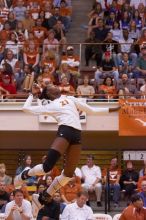 UT sophomore Destinee Hooker (#21, OH) floats in the air, waiting to spike the ball.  The Longhorns defeated the Huskers 3-0 on Wednesday night, October 24, 2007 at Gregory Gym.

Filename: SRM_20071024_1850226.jpg
Aperture: f/4.0
Shutter Speed: 1/400
Body: Canon EOS-1D Mark II
Lens: Canon EF 80-200mm f/2.8 L
