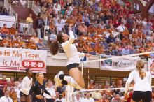 UT freshman Juliann Faucette (#1, OH) floats in the air, waiting for the spike, as teammates UT sophomore Destinee Hooker (#21, OH) UT senior Alyson Jennings (#16, L) and UT sophomore Ashley Engle (#10, S/RS) watch.  The Longhorns defeated the Huskers 3-0

Filename: SRM_20071024_1859161.jpg
Aperture: f/4.0
Shutter Speed: 1/200
Body: Canon EOS-1D Mark II
Lens: Canon EF 80-200mm f/2.8 L