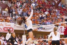 UT freshman Juliann Faucette (#1, OH) spikes the ball as teammates UT sophomore Destinee Hooker (#21, OH) UT senior Alyson Jennings (#16, L), UT sophomore Ashley Engle (#10, S/RS) and Nebraska sophomore Kori Cooper (#15, MB) watch.  The Longhorns defeated

Filename: SRM_20071024_1859202.jpg
Aperture: f/4.0
Shutter Speed: 1/200
Body: Canon EOS-1D Mark II
Lens: Canon EF 80-200mm f/2.8 L