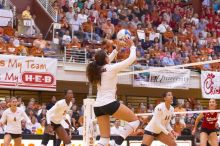 UT freshman Juliann Faucette (#1, OH) sets the ball as UT senior Michelle Moriarty (#4, S), UT sophomore Destinee Hooker (#21, OH), UT senior Brandy Magee (#44, MB), and Nebraska junior Jordan Larson (#10, OH) watch.  The Longhorns defeated the Huskers 3-0

Filename: SRM_20071024_1900103.jpg
Aperture: f/4.0
Shutter Speed: 1/200
Body: Canon EOS-1D Mark II
Lens: Canon EF 80-200mm f/2.8 L