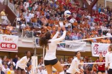 UT freshman Juliann Faucette (#1, OH) sets the ball as UT sophomore Destinee Hooker (#21, OH), UT senior Brandy Magee (#44, MB), and Nebraska junior Jordan Larson (#10, OH) watch.  The Longhorns defeated the Huskers 3-0 on Wednesday night, October 24, 2007

Filename: SRM_20071024_1900144.jpg
Aperture: f/4.0
Shutter Speed: 1/200
Body: Canon EOS-1D Mark II
Lens: Canon EF 80-200mm f/2.8 L