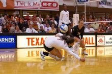 UT freshman Juliann Faucette (#1, OH) misses the ball as UT senior Alyson Jennings (#16, L) and UT sophomore Destinee Hooker (#21, OH) watch.  The Longhorns defeated the Huskers 3-0 on Wednesday night, October 24, 2007 at Gregory Gym.

Filename: SRM_20071024_1901568.jpg
Aperture: f/4.0
Shutter Speed: 1/400
Body: Canon EOS-1D Mark II
Lens: Canon EF 80-200mm f/2.8 L