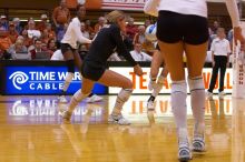 UT senior Alyson Jennings (#16, L) bumps the ball as teammate UT sophomore Destinee Hooker (#21, OH) watches.  The Longhorns defeated the Huskers 3-0 on Wednesday night, October 24, 2007 at Gregory Gym.

Filename: SRM_20071024_1902281.jpg
Aperture: f/4.0
Shutter Speed: 1/400
Body: Canon EOS-1D Mark II
Lens: Canon EF 80-200mm f/2.8 L