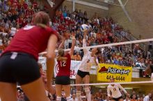 UT junior Lauren Paolini (#3, UTIL) spikes the ball past Nebraska sophomore Rachel Holloway (#12, S) as UT sophomore Ashley Engle (#10, S/RS) and Nebraska senior Sarah Pavan (#9, RS) watch.  The Longhorns defeated the Huskers 3-0 on Wednesday night, Octobe

Filename: SRM_20071024_1914388.jpg
Aperture: f/4.0
Shutter Speed: 1/400
Body: Canon EOS-1D Mark II
Lens: Canon EF 80-200mm f/2.8 L