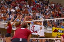 UT sophomore Ashley Engle (#10, S/RS) spikes towards Nebraska junior Jordan Larson (#10, OH) as UT senior Michelle Moriarty (#4, S) and Nebraska senior Sarah Pavan (#9, RS) watch.  The Longhorns defeated the Huskers 3-0 on Wednesday night, October 24, 2007

Filename: SRM_20071024_1915286.jpg
Aperture: f/4.0
Shutter Speed: 1/400
Body: Canon EOS-1D Mark II
Lens: Canon EF 80-200mm f/2.8 L