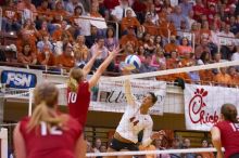 UT senior Brandy Magee (#44, MB) spikes past Nebraska junior Jordan Larson (#10, OH) as Nebraska sophomore Rachel Holloway (#12, S) and Nebraska sophomore Kori Cooper (#15, MB) wait.  The Longhorns defeated the Huskers 3-0 on Wednesday night, October 24, 2

Filename: SRM_20071024_1917321.jpg
Aperture: f/3.5
Shutter Speed: 1/400
Body: Canon EOS-1D Mark II
Lens: Canon EF 80-200mm f/2.8 L