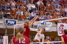 UT senior Brandy Magee (#44, MB) spikes past Nebraska junior Jordan Larson (#10, OH) as Nebraska sophomore Rachel Holloway (#12, S) and Nebraska sophomore Kori Cooper (#15, MB) wait.  The Longhorns defeated the Huskers 3-0 on Wednesday night, October 24, 2

Filename: SRM_20071024_1917342.jpg
Aperture: f/3.5
Shutter Speed: 1/400
Body: Canon EOS-1D Mark II
Lens: Canon EF 80-200mm f/2.8 L