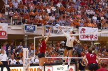 UT junior Lauren Paolini (#3, UTIL) spikes the ball as Nebraska junior Jordan Larson (#10, OH) attempts to block it and Nebraska sophomore Kori Cooper (#15, MB) watches.  The Longhorns defeated the Huskers 3-0 on Wednesday night, October 24, 2007 at Gregor

Filename: SRM_20071024_1924383.jpg
Aperture: f/4.0
Shutter Speed: 1/400
Body: Canon EOS-1D Mark II
Lens: Canon EF 80-200mm f/2.8 L