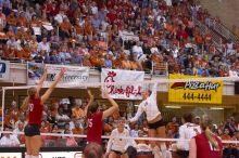 UT sophomore Ashley Engle (#10, S/RS) spikes the ball as Nebraska junior Jordan Larson (#10, OH) and Nebraska sophomore Kori Cooper (#15, MB) attempt to block it, and UT senior Michelle Moriarty (#4, S), UT junior Lauren Paolini (#3, UTIL) and Nebraska sop

Filename: SRM_20071024_1924468.jpg
Aperture: f/4.0
Shutter Speed: 1/400
Body: Canon EOS-1D Mark II
Lens: Canon EF 80-200mm f/2.8 L