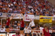 UT sophomore Ashley Engle (#10, S/RS) spikes the ball as Nebraska junior Jordan Larson (#10, OH) and Nebraska sophomore Kori Cooper (#15, MB) attempt to block it, and UT senior Michelle Moriarty (#4, S), UT junior Lauren Paolini (#3, UTIL) and Nebraska sop

Filename: SRM_20071024_1924469.jpg
Aperture: f/4.0
Shutter Speed: 1/400
Body: Canon EOS-1D Mark II
Lens: Canon EF 80-200mm f/2.8 L