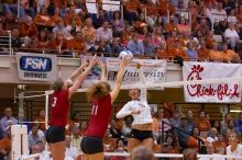 UT sophomore Ashley Engle (#10, S/RS) hits the ball past blockers Nebraska senior Christina Houghtelling (#3, OH) and Nebraska senior Tracy Stalls (#11, MB).  The Longhorns defeated the Huskers 3-0 on Wednesday night, October 24, 2007 at Gregory Gym.

Filename: SRM_20071024_1928481.jpg
Aperture: f/4.0
Shutter Speed: 1/400
Body: Canon EOS-1D Mark II
Lens: Canon EF 80-200mm f/2.8 L