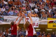 UT sophomore Ashley Engle (#10, S/RS) hits the ball as Nebraska senior Christina Houghtelling (#3, OH) and Nebraska senior Tracy Stalls (#11, MB) attempt to block.  The Longhorns defeated the Huskers 3-0 on Wednesday night, October 24, 2007 at Gregory Gym.

Filename: SRM_20071024_1929223.jpg
Aperture: f/4.0
Shutter Speed: 1/400
Body: Canon EOS-1D Mark II
Lens: Canon EF 80-200mm f/2.8 L